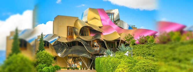 Get my Trip Tirol Reisetipps - Marqués de Riscal Design Hotel, Bilbao, Elciego, Spanien. Fantastisch galaktisch, unverkennbar ein Werk von Frank O. Gehry. Inmitten idyllischer Weinberge in der Rioja Region des Baskenlandes, bezaubert das schimmernde Bauobjekt mit einer Struktur bunter, edel glänzender verflochtener Metallbänder. Glanz im Baskenland - Es muss etwas ganz Besonderes sein. Emotional, zukunftsweisend, einzigartig. Denn in dieser Region, etwa 133 km südlich von Bilbao, sind Weingüter normalerweise nicht für die Öffentlichkeit zugänglich.